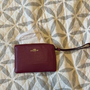 Brand new Coach pink Leather Wristlet